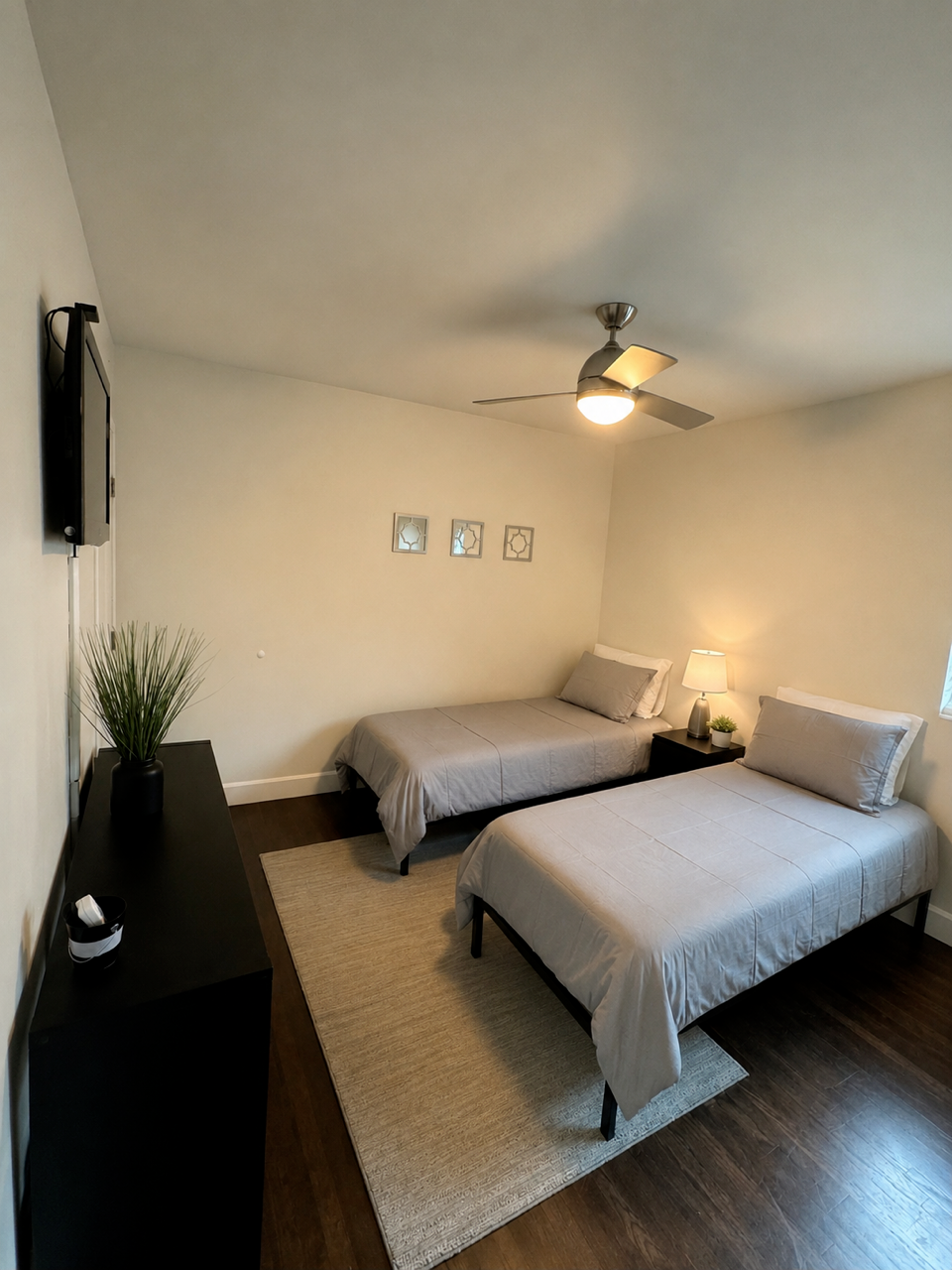 Shared bedroom with gray bedding